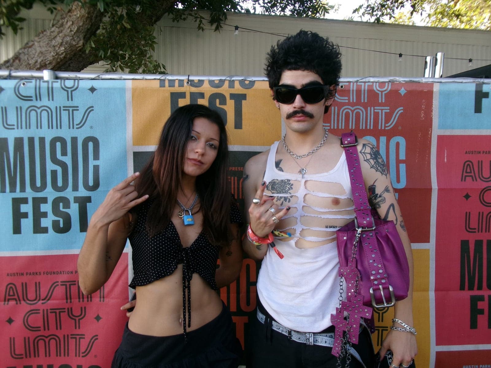 Almost Heaven’s Jaelyn Valero and Stefan Barraza in front of the Austin City Limits Music Fest backdrop.